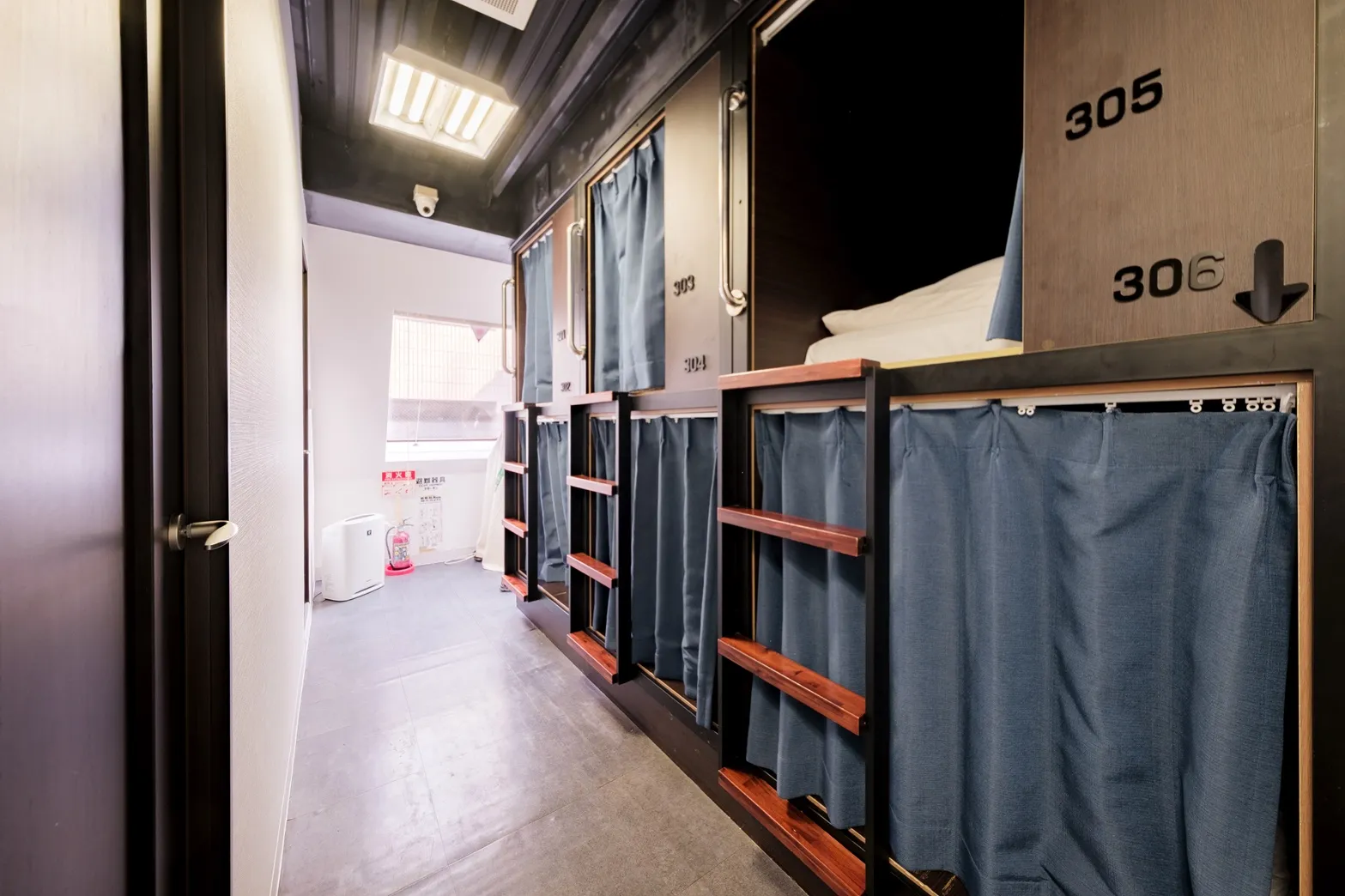 Male dormitory with capsule beds at Hostel JAZ Ueno Tokyo